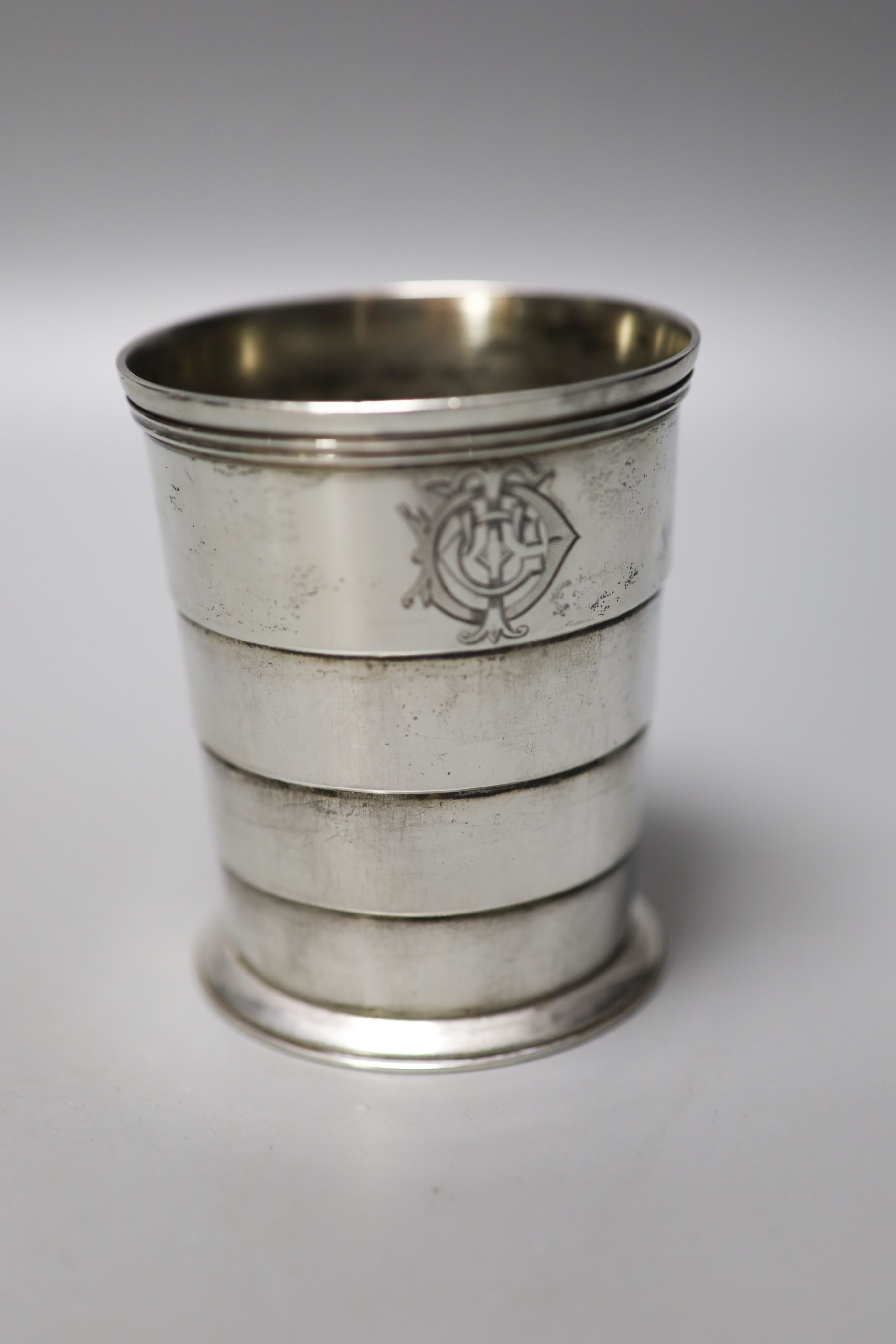 A Victorian silver travelling telescopic cup, Wright & Davis, London, 1881, 89mm, two sugar casters, a mounted glass tidy and a silver mounted salts bottle.